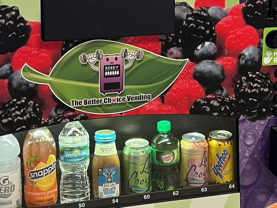 A Better Choice Vending machine wrapped in the company's branding, stocked with drinks and snacks